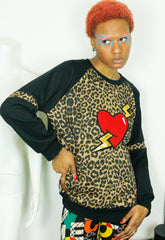 LOVE HURTS Leopard and black oversize sweater with large heart and lightning bolts